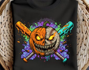 May include: Black crewneck sweatshirt featuring a Halloween-themed graphic. The design showcases a split pumpkin-baseball with glowing eyes and a menacing grin, crossed with orange and teal baseball bats. Colorful paint splatters surround the central image.