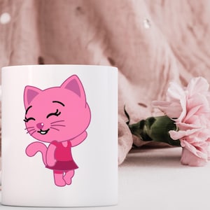 May include: White ceramic mug featuring a pink cartoon cat with a dress. The cat has a smiling face and is waving. A pink flower and a pink fabric are in the background.