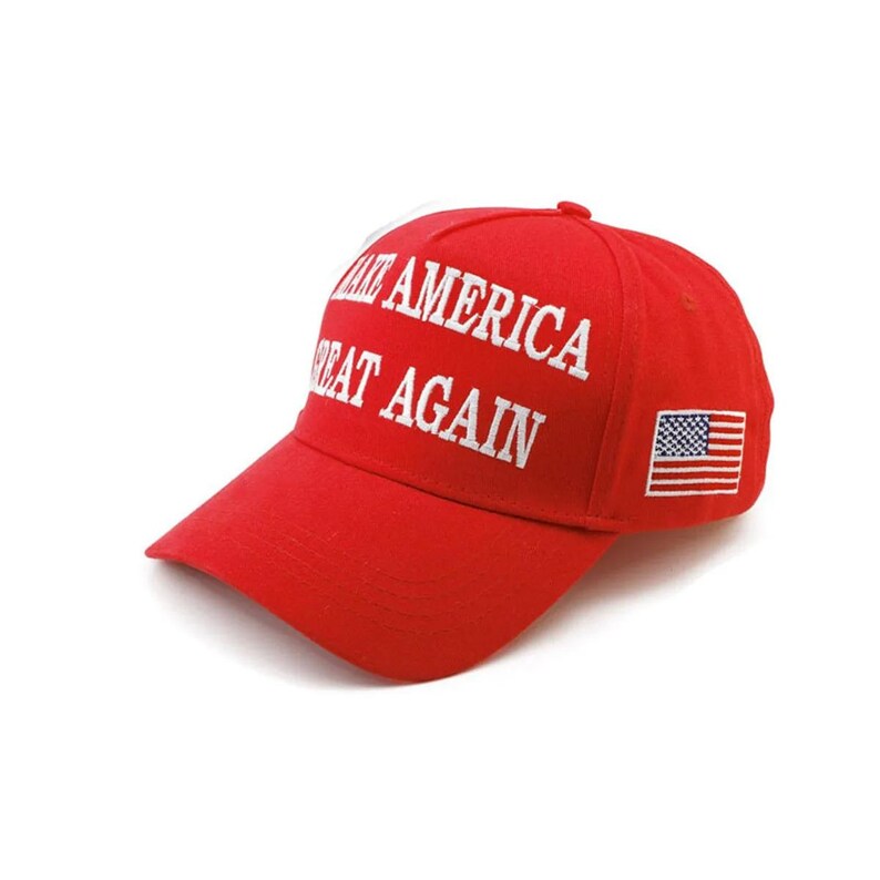 May include: A red baseball cap with the text "MAKE AMERICA GREAT AGAIN" embroidered in white across the front. The cap features a curved brim and an American flag patch on the side.