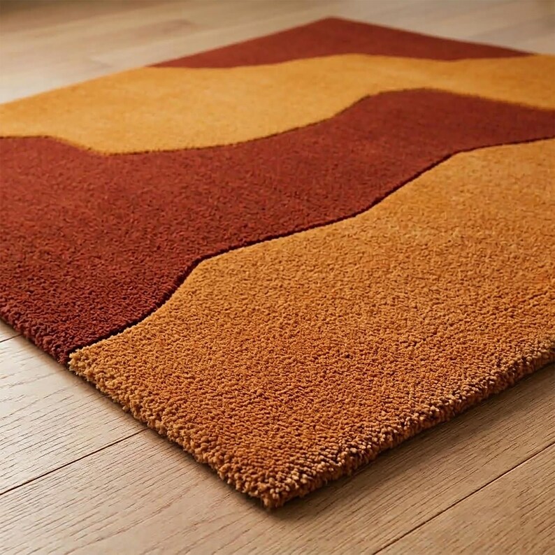 Close view of the rug corner showing its rectangular shape, clean edge, textured wool surface, and warm earthy abstract pattern.