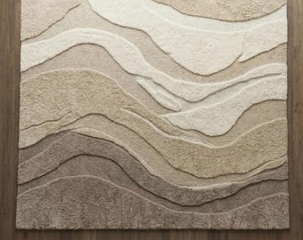 モダンな質感のウールラグ、ニュートラルなベージュトープの立体的なエリアラグ