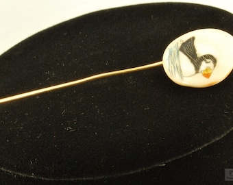 Hand-painted porcelain vintage lapel pin with a puffin design and gold-plated pin stopper