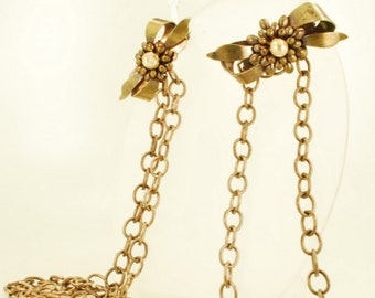 Vintage double strand yellow gold (filled), gold-toned base metal & faux pearl sweater chain with bow-style lapel pins