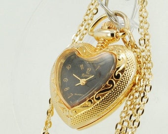 Ronica quartz ladies' pendant watch, gold-toned heart-shaped engraved case, 18" oval-link necklace