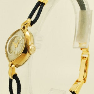 Helbros vintage ladies' wrist watch, 21 jewels, attractive gold-toned & stainless steel slender oval-shaped case image 1