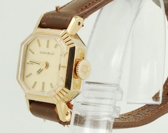 Caravelle by Bulova vintage ladies' wrist watch, 17 jewels, YBM & SS case, gold-toned pattern finish dial