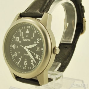 Steel quartz with date wrist watch, silver-toned gunmetal water-resistant case, black Canadian-style dial