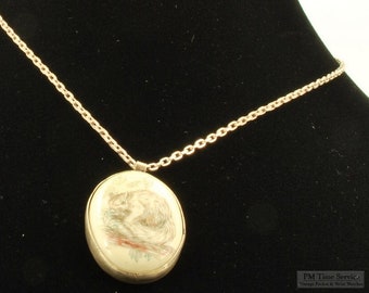 Vintage oval silver and wood squirrel engraved pendant with a matching silver necklace