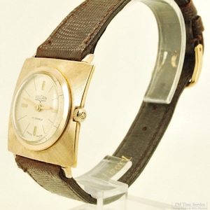 Vulcain vintage wrist watch, 17 jewels, distinctive gold-toned & stainless steel thin-model square case, sunburst engraved design