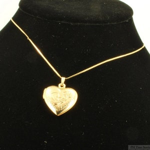 Yellow gold plated heart-shaped locket with a matching 15.5 serpentine-link necklace, elaborate engraved flower image 1