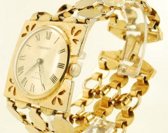 Corocraft (Swiss) vintage wrist watch, 17 jewels, engraved gold-toned square case, cut-out floral accents, matching band