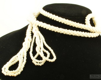 Vintage 58.5" glass seed pearl strand necklace with three loops of glass pearl tassels at ends