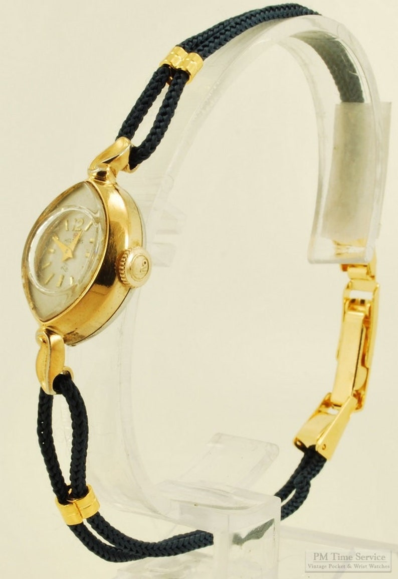 Helbros vintage ladies' wrist watch, 21 jewels, attractive gold-toned & stainless steel slender oval-shaped case image 1