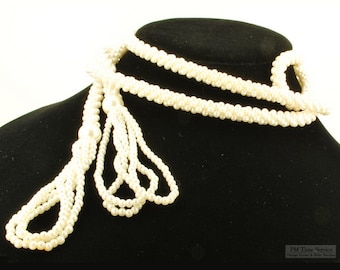 58.5" glass seed pearl strand vintage necklace, with three loops of glass pearl tassels at ends