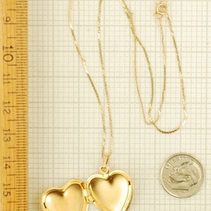 Yellow gold plated heart-shaped locket with a matching 15.5 serpentine-link necklace, elaborate engraved flower image 4