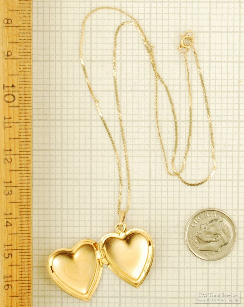 Yellow gold plated heart-shaped locket with a matching 15.5 serpentine-link necklace, elaborate engraved flower image 4