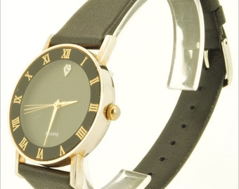 Chinese-made vintage quartz wrist watch, gold-toned & stainless steel round case, dark green dial with crystal, black leather band