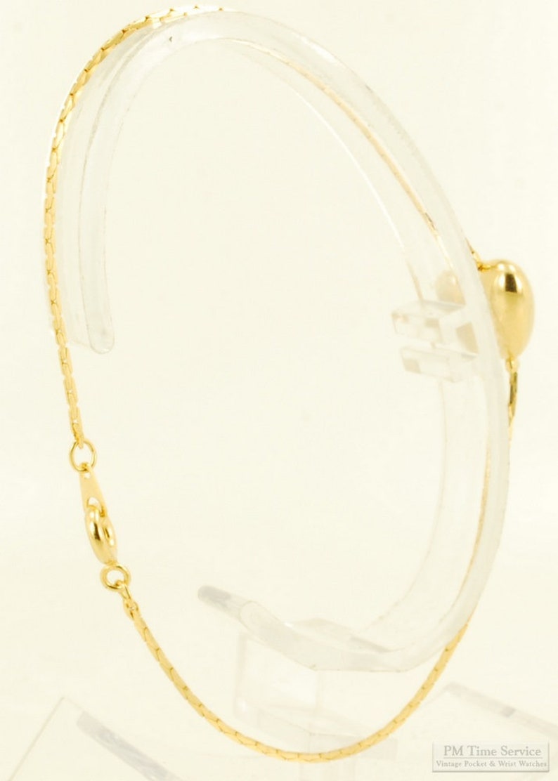 8 yellow gold plated snake-style link bracelet with a puffed heart accent image 2