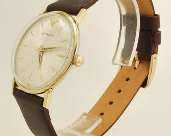 Relógio de pulso vintage Wittnauer AXA grau 11BG3, 17 rubis, elegante caixa redonda fina em ouro amarelo (banhado), modelo nº 1200, resistente à água.