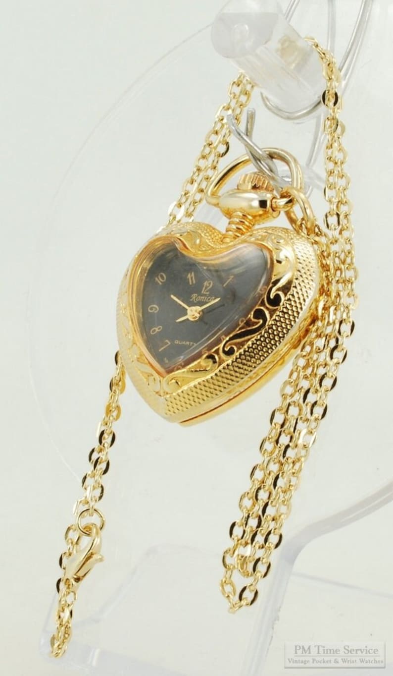 Ronica quartz ladies' pendant watch, gold-toned heart-shaped engraved case, 18 oval-link necklace image 1