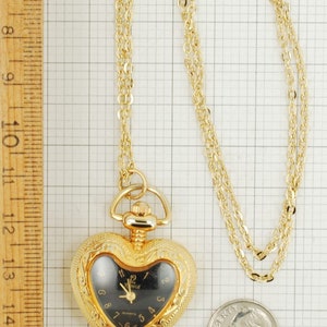 Ronica quartz ladies' pendant watch, gold-toned heart-shaped engraved case, 18 oval-link necklace image 5