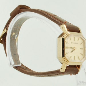 Caravelle by Bulova vintage ladies' wrist watch, 17 jewels, YBM & SS case, gold-toned pattern finish dial image 2