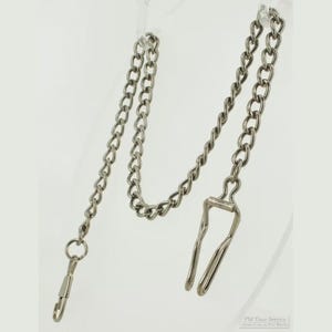 May include: A silver-toned metal pocket watch chain featuring a series of interlocking oval links. One end of the chain terminates in a spring-loaded swivel clasp, while the other end features a sturdy belt hook attachment for secure fastening.