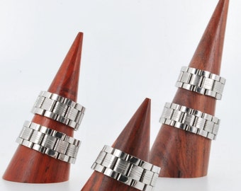Repurposed stainless steel watch band rings, in a variety of styles and sizes