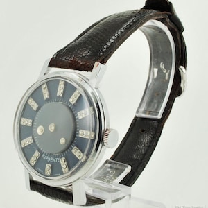 Chancellor Watch Co. for Alavente cal. 1013 vintage wrist watch, 1 jewel, round chrome case, "mystery dial"