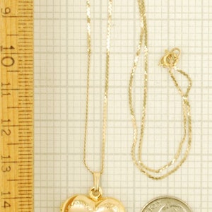 Yellow gold plated heart-shaped locket with a matching 15.5 serpentine-link necklace, elaborate engraved flower image 3