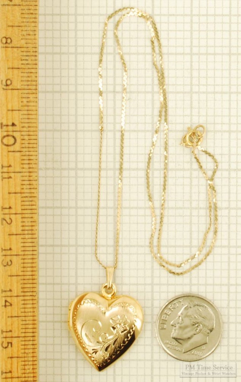 Yellow gold plated heart-shaped locket with a matching 15.5 serpentine-link necklace, elaborate engraved flower image 3