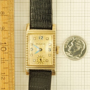 Bulova vintage grade 7AK 49 wrist watch, 21 jewels, distinctive yellow gold filled rectangular case with a scalloped design image 6