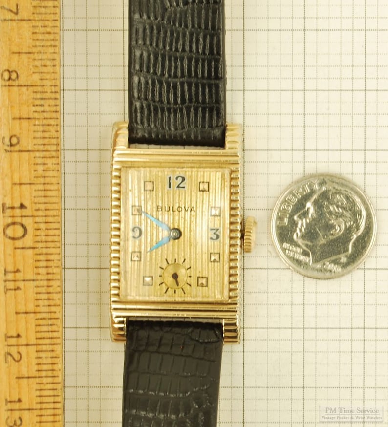 Bulova vintage grade 7AK 49 wrist watch, 21 jewels, distinctive yellow gold filled rectangular case with a scalloped design image 6