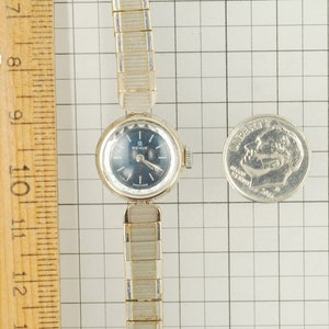Revue grade 8D vintage ladies' wrist watch, 17 jewels, elegant round gold-toned & stainless steel case, dark blue metal dial image 6
