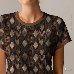 May include: A short-sleeved t-shirt featuring a dark brown and black snakeskin-inspired pattern with a repeating diamond motif. The garment has a solid brown crew neckline and matching brown sleeve cuffs. The text EXAMPLE PRODUCT ONLY is visible.