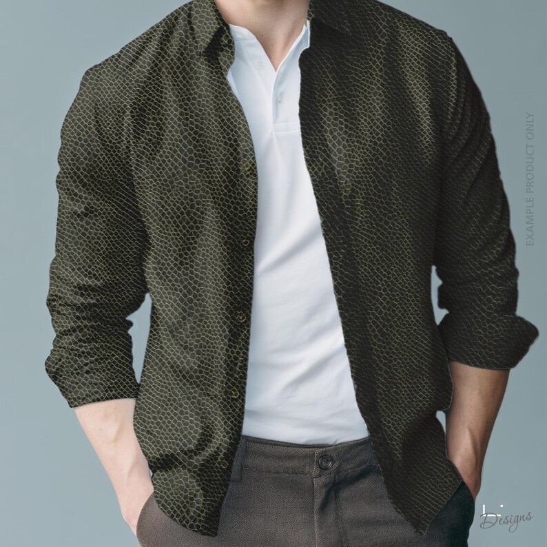 May include: A long-sleeved button-down shirt featuring a dark olive green and black snakeskin-like scale pattern. The shirt is worn unbuttoned over a plain white polo shirt, paired with dark grey trousers. The text EXAMPLE PRODUCT ONLY is visible.