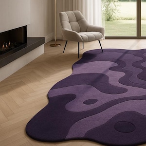 Hand tufted irregular purple abstract wool rug with wavy layered design, modern statement carpet for living room décor"