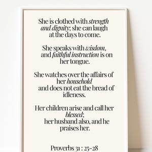 May include: A framed print with a cream-colored background features a quote from Proverbs 31:25-28 in black text. The quote speaks of strength, dignity, wisdom, and the blessings of family. The print is in a white frame.