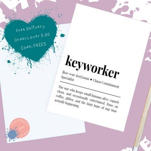 May include: A white card featuring the word "keyworker" in a bold, black font, with a definition below. A teal heart shape with text is in the upper left, and a logo is in the lower left corner. The background is a light purple.