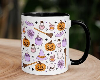 May include: White ceramic mug with a black interior and handle, decorated with a repeating pattern of Halloween-themed illustrations. The design includes orange pumpkins, purple witch hats, bats, potion bottles, and spiderwebs.