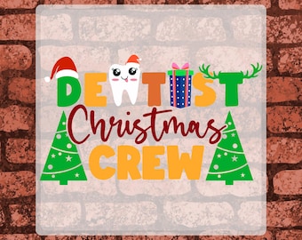 May include: A DTF transfer sheet featuring the text DENTIST CHRISTMAS CREW in green, orange, and red. The design includes a cartoon tooth wearing a Santa hat, a blue gift box, green reindeer antlers, and two green Christmas trees with stars.