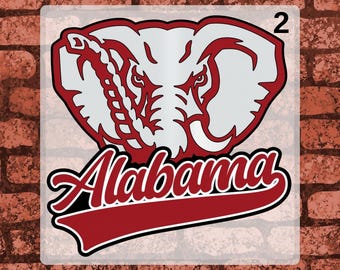 May include: A DTF transfer sheet featuring a graphic of an elephant head in white and maroon with the text Alabama in a script font below it. The design includes the number 2 in the top right corner and the text DTF TRANSFER and READY TO PRESS.