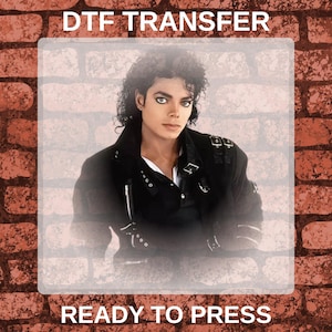 May include: DTF transfer featuring a portrait of Michael Jackson in a black jacket. The image is set against a brick wall background. Text at the top reads "DTF TRANSFER" and at the bottom "READY TO PRESS".