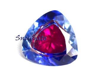 Impresionante zafiro Pitambari natural suelto de 18 quilates, bicolor azul y rosa, con elegante talla trillón, ideal para joyería fina y coleccionismo.