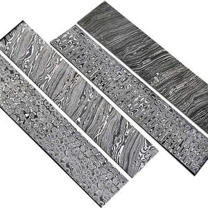 May include: A collection of six rectangular steel knife scales with intricate, swirling patterns in shades of gray and black. The patterns vary, showcasing different textures and designs, suitable for knife making.