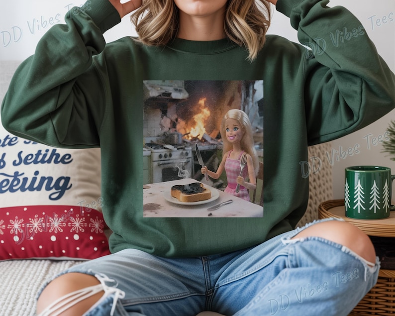 May include: A white ceramic mug with a black handle and the text "But First, Coffee" in a bold, black font. The mug is set against a blurred background, suggesting a cozy setting.