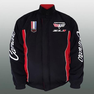 May include: Black jacket with red accents and white lettering. The jacket features the word "Camaro" on the sleeves and "Zl1" and "Camaro" logos on the chest. The collar is red.