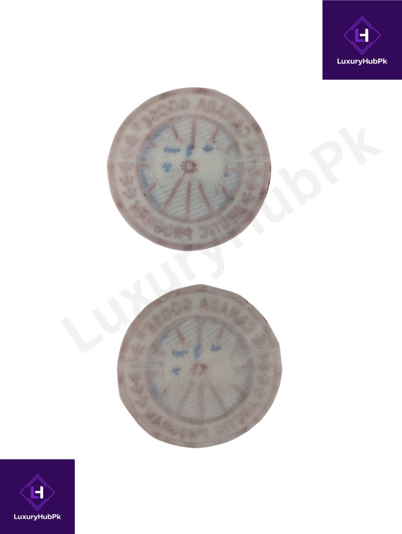 May include: Two circular, vintage-style stamps with faded red and blue details. The stamps feature text around the edges and a central design with radial lines. The stamps are set against a white background.