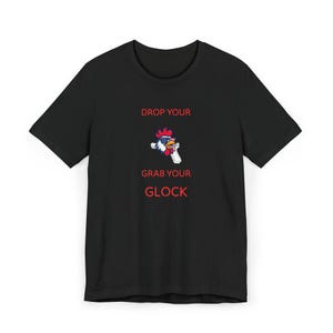 May include: Black t-shirt with the text "DROP YOUR GRAB YOUR GLOCK" in red. The shirt features a cartoon rooster wearing sunglasses and holding a gun, with the American flag colours.