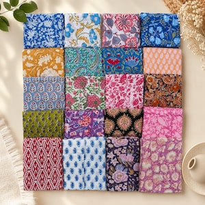 May include: A collection of twenty square fabric swatches arranged in a grid, each featuring distinct floral, paisley, and geometric block-print patterns in a vibrant palette of blue, pink, yellow, green, orange, black, and purple hues.